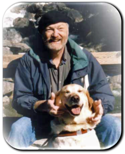 Darrell and his guide dog, Gepeto, sitting near a mountain stream.